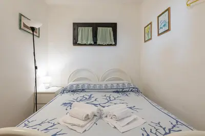 Letto o letti in una camera di Villetta vista mare a 100 mt di distanza