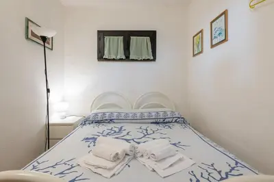 Letto o letti in una camera di Villetta vista mare a 100 mt di distanza