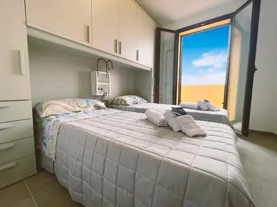 Letto o letti in una camera di Residence Oleandri- Oleandro Rosso