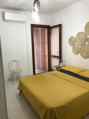 Letto o letti in una camera di Casa Giogiò