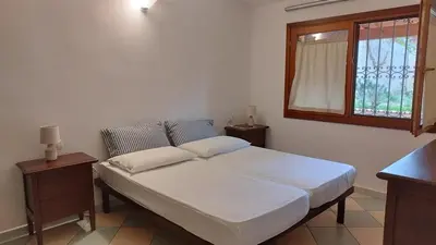 Letto o letti in una camera di Casa Olivo Le ginestre