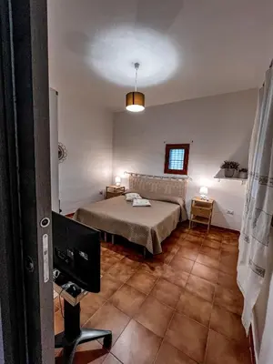Letto o letti in una camera di Casa Chiara con accesso diretto alla spiaggia