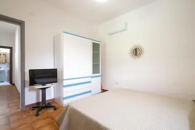 Letto o letti in una camera di Casa Chiara con accesso diretto alla spiaggia