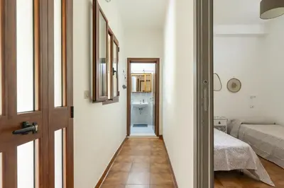 Letto o letti in una camera di Casa Chiara con accesso diretto alla spiaggia
