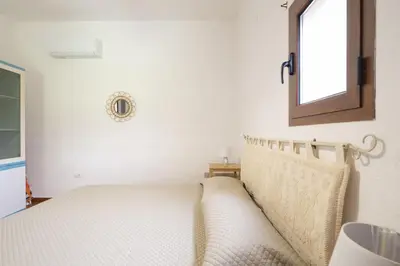 Letto o letti in una camera di Casa Chiara con accesso diretto alla spiaggia