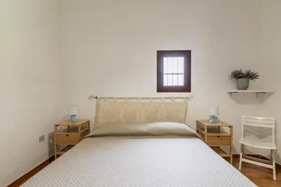 Letto o letti in una camera di Casa Chiara con accesso diretto alla spiaggia