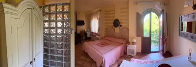 Letto o letti in una camera di Villa Madau