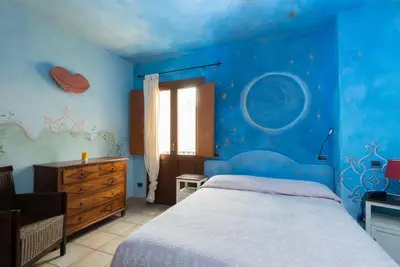 Letto o letti in una camera di Villa Madau