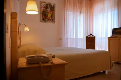 Letto o letti in una camera di Hotel Califfo