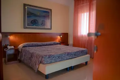 Letto o letti in una camera di Hotel Califfo