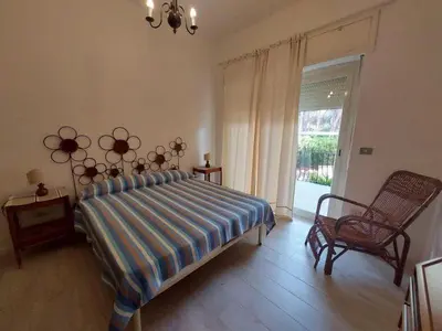Letto o letti in una camera di La Perla al mare 300mt from Perla Marina Beach