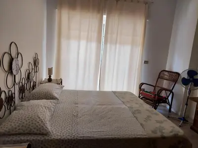 Letto o letti in una camera di La Perla al mare 300mt from Perla Marina Beach