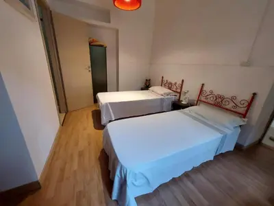 Letto o letti in una camera di La Perla al mare 300mt from Perla Marina Beach