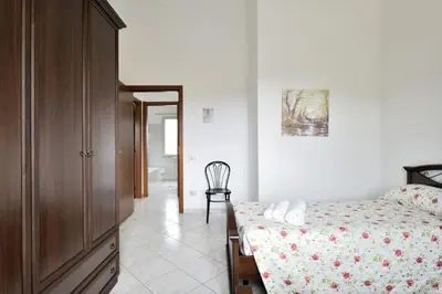 Letto o letti in una camera di casa vacanza Luciano