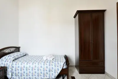 Letto o letti in una camera di casa vacanza Luciano