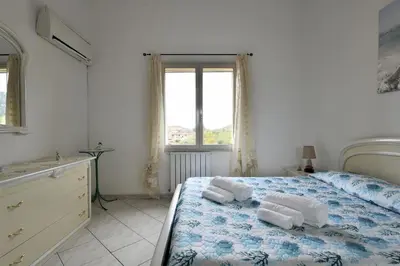 Letto o letti in una camera di casa vacanza Luciano