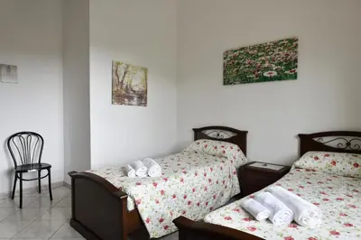 Letto o letti in una camera di casa vacanza Luciano