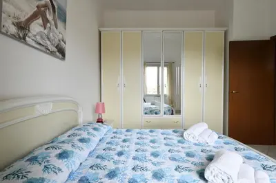 Letto o letti in una camera di casa vacanza Luciano
