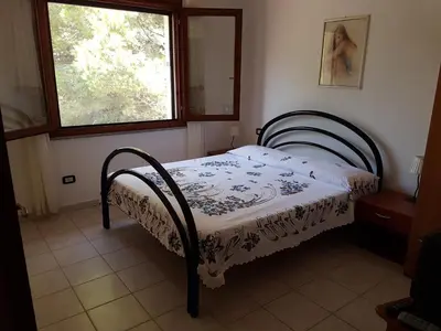 Letto o letti in una camera di Casa Giovanna
