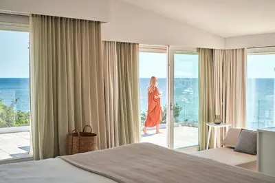 Letto o letti in una camera di Falkensteiner Resort Capo Boi