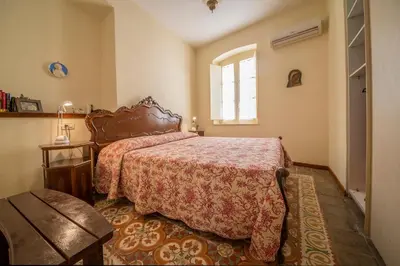 Letto o letti in una camera di Casa Anna