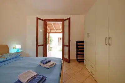 Letto o letti in una camera di casa vacanza mika