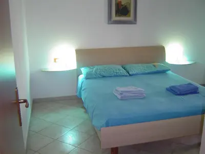 Letto o letti in una camera di casa vacanza mika