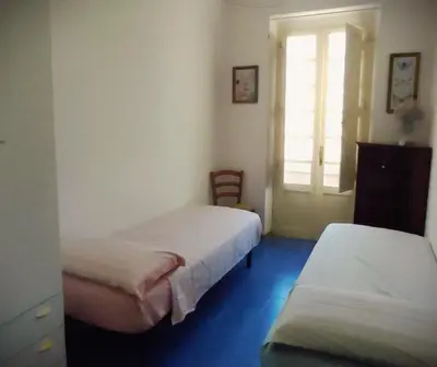 Letto o letti in una camera di Large and cosy apartment in the centre of Cagliari