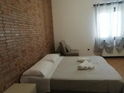 Letto o letti in una camera di Domo Biriala