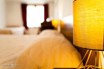 Letto o letti in una camera di MURAHERA GUEST HOUSE