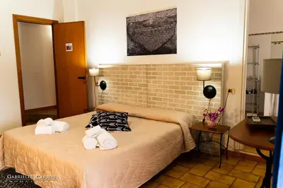Letto o letti in una camera di MURAHERA GUEST HOUSE