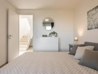 Letto o letti in una camera di Villa Latisa