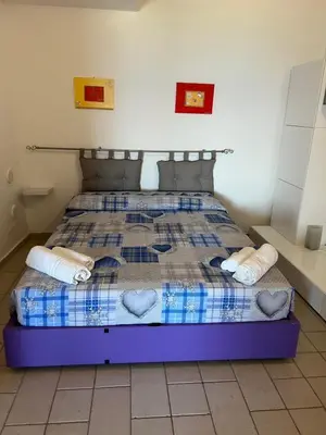 Letto o letti in una camera di Bilocale Acquamarina presso i nidi dei cormorani