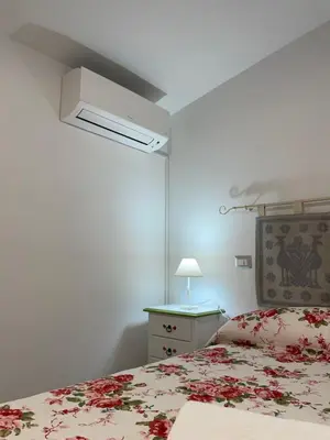 Letto o letti in una camera di Affittacamere Il Vicoletto Aria Ona