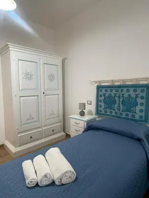 Letto o letti in una camera di Affittacamere Il Vicoletto Aria Ona