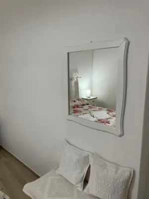 Letto o letti in una camera di Affittacamere Il Vicoletto Aria Ona