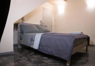 Letto o letti in una camera di Via Cavour 19, Camere del Conte