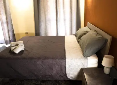 Letto o letti in una camera di Via Cavour 19, Camere del Conte