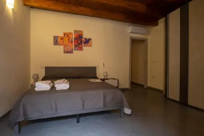 Letto o letti in una camera di Via Cavour 19, Appartamento del Conte