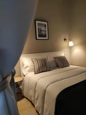 Letto o letti in una camera di Manno Rooms Affittacamere