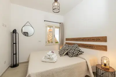 Letto o letti in una camera di Appartamenti Nonna Rosa