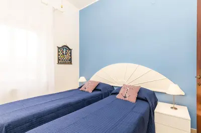 Letto o letti in una camera di Coastal Home