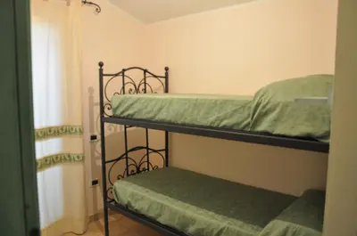 Letto o letti in una camera di Chia al mare