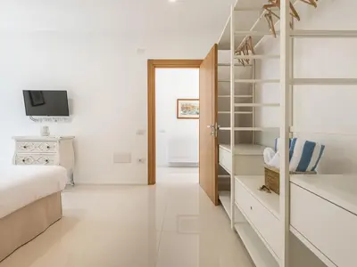TV o dispositivi per l'intrattenimento presso Luxury Poetto Apartments
