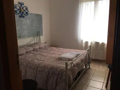 Letto o letti in una camera di AZIENDA AGRITURISTICA S'ARGALASI - B&B - AFFITTACAMERE Loc S'Argalasi Austis