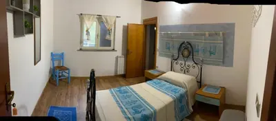 Letto o letti in una camera di AZIENDA AGRITURISTICA S'ARGALASI - B&B - AFFITTACAMERE Loc S'Argalasi Austis