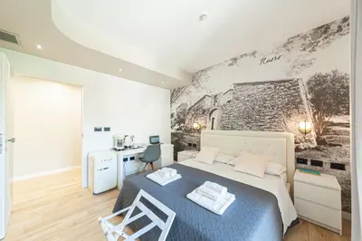 Letto o letti in una camera di Eleonore Elegant Rooms
