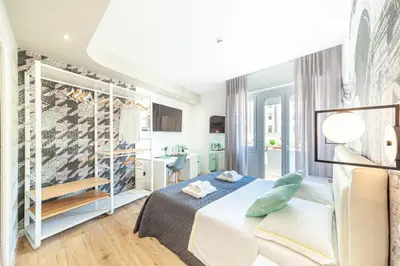 Letto o letti in una camera di Eleonore Elegant Rooms
