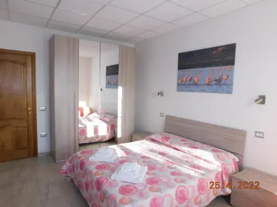 Letto o letti in una camera di B&B DiVino