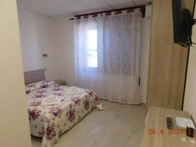 Letto o letti in una camera di B&B DiVino